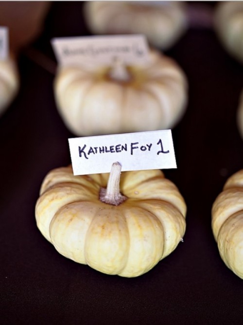 natural pumpkins with cards are creative and easy escort cards for a fall wedding