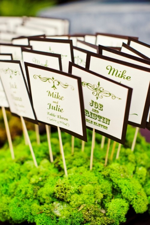 bright moss with bold framed cards put on sticks are nice fall escort cards and they look whimsical