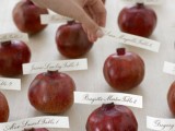 pomegranates with cards are a very lush and elegant idea for fall escort cards