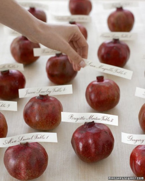 pomegranates with cards are a very lush and elegant idea for fall escort cards