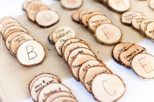 wood slice escort cards will be a nice idea for a fall woodland wedding or any rustic one