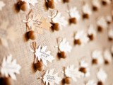felt acorns with cards are very lovely escort cards that you cna easily make yourself for the wedding