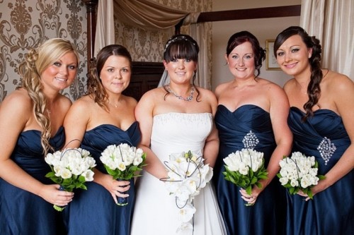 strapless navy bridesmaid dresses accented with silver embellishments look very bold and stylish