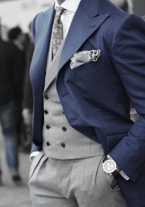 a super elegant groom's look with a morning suit - a navy jacket, a grey suit, a white shirt and a printed tie