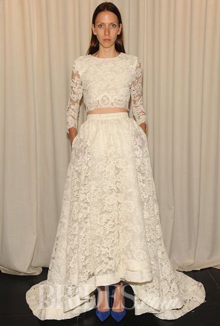 a sophisticated lace two-piece wedding dress with a crop top with long sleeves and a high low maxi skirt with a train plus electric blue shoes are a gorgeous combo