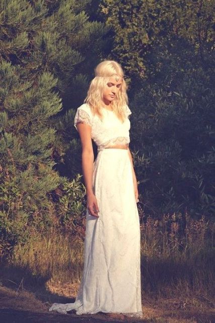 a boho bridal look with a lace two-piece dress, with a crop top with short sleeves and a maxi bridal skirt with a train is a beautiful idea