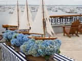 pallet boxes with blue hydrangeas and boats for a blue nautical or beach wedding