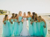 neon blue strapless maxi bridesmaid dresses with draped bodices for a blue beach wedding