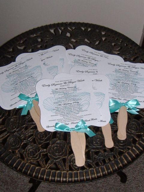 cut out beach wedding menus or programs decorated with blue bows are great for a blue beach wedding