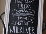 a black chalkboard sign in a vintage white frame will fit a vintage or rustic wedding, and you can DIY it