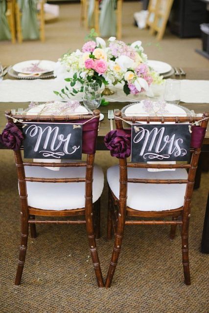 a black chalkboard sign with calligraphy like this one will beautifully accent your wedding chairs