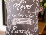 a refined and chic chalkboard sign with calligraphy, it can be rocked throughout your venue and it will look great