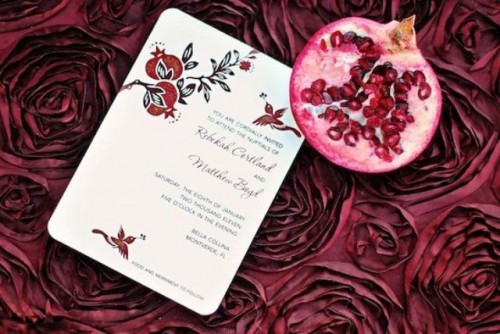 a painted pomegranate wedding invitation with leaves is a beautiful and bold solution for a bright wedding in the fall