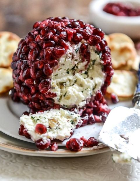 a cheese ball covered with pomegranated seeds is a lovely idea for a wedding, it's a delicious appetized for a celebration