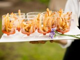 French fries with tomato sauce served in elegant cups are a cool idea