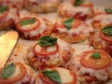 mini Margaret pizzas with cheese, tomatoes and herbs are a delicious snack