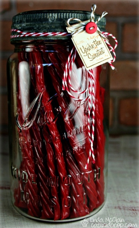 jars with Christmas candies and cute tags are budget-friendly wedding favors that you can DIY