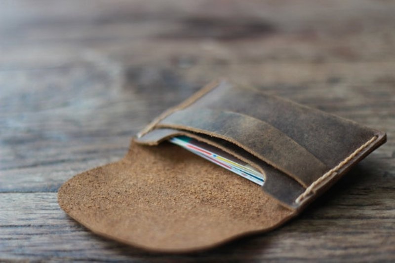 A brown leather case for credit cards is always a good idea   each person will appreciate it