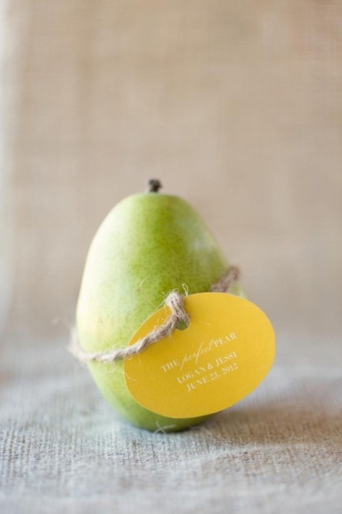 a pear with a meaningful tag is a great beach or other wedding favor idea with a touch of humor