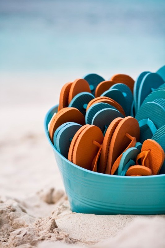 Colorful flipflops are a timeless and comfy wedding favor idea to rock, your guests will be grateful
