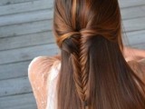 a stylish and cool wedding half updo with a fishtail braid and straight hair down is a cool solution for a boho bride