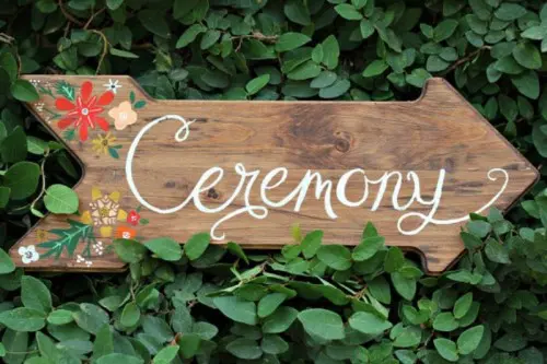 a wood plaque sign with calligraphy and decor is a lovely idea for a rustic or woodland wedding, and you can DIY as many of them as you need