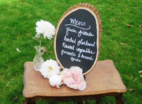 a chalkboard wood slice wedding menu is a cool idea for a rustic wedding, and you can DIY some yourself, it's pretty easy