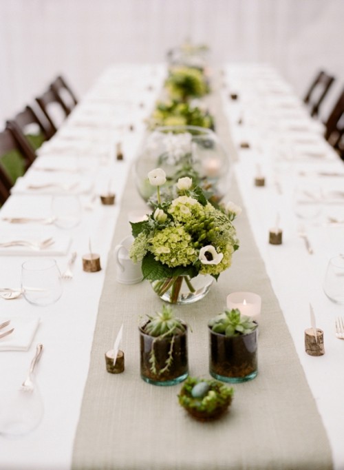 a neutral wedding tablescape with white floral arrangements and greenery, potted succulents, wood pieces to hold the cards - these card holders give a woodland or rustic feel to the table