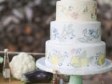 a neutral wedding cake with painted tiers – fruit, berry and floral ones done in pastel shades is a very cute and lovely idea for a spring or summer wedding