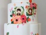 a white buttercream wedding cake with bold painted blooms, little portraits of the couple is a lovely idea for a summer wedding