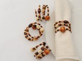 pretty amber, brown and creamy beaded napkin rings are a great idea for a boho wedding