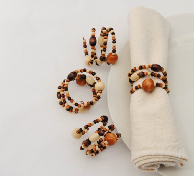 pretty amber, brown and creamy beaded napkin rings are a great idea for a boho wedding