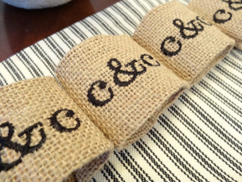 stenciled monogram burlap napkin rings are perfect for a rustic wedding and they will add a personalized touch to your tablescape