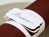 a white cardboard napkin ring with a name is a nice alternative to a usual card and is rather easy to make