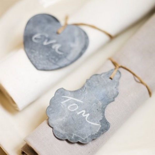 twine napkin rings with black chalkboard tags that act as place cards are amazing for a rustic wedding