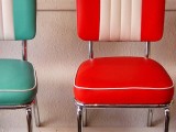 bright color block leather chairs are a nice fit for a retro kitchen