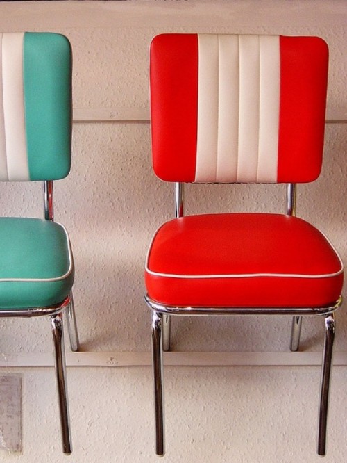 bright color block leather chairs are a nice fit for a retro kitchen