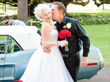 a strapless midi length wedding dress, red shoes, a pearl necklace and a birdcage veil for an ultimate retro bridal look