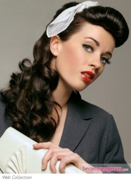 a retro-inspired hairstyle with a sleek bump and long wavy ponytail plus a white hair tie