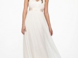 a sleeveless pleated A-line wedding dress with thick sheer straps and an embellished sash