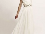 a Grecian draped one shoulder A-line wedding dress with a chain belt and detailing on the shoulder plus a train