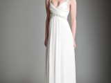 a Grecian style draped wedding dress with am embellished sash and straps and a deep neckline