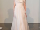 an A-line blush one shoulder wedding dress with draperies is inspired by Grecian lines and silhouettes