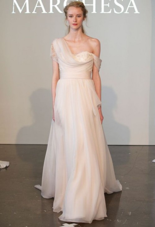 an A-line blush one shoulder wedding dress with draperies is inspired by Grecian lines and silhouettes