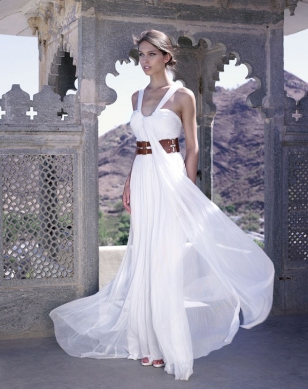 A pleated A line wedding dress with a bandage bodice, thick straps, a brown leather belt and a pleated skirt