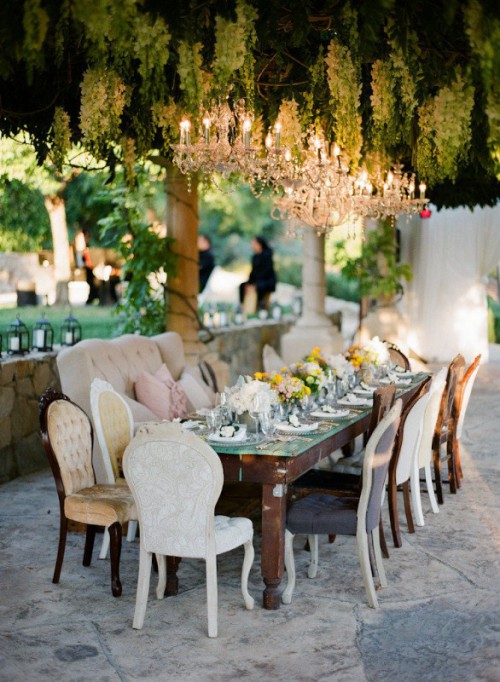 green and white floral garlands and chandeliers over the reception make it more refined and lively at the same time