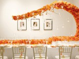 bold orange blooms going along the table and curling up over it for a cool and bold look that catches an eye
