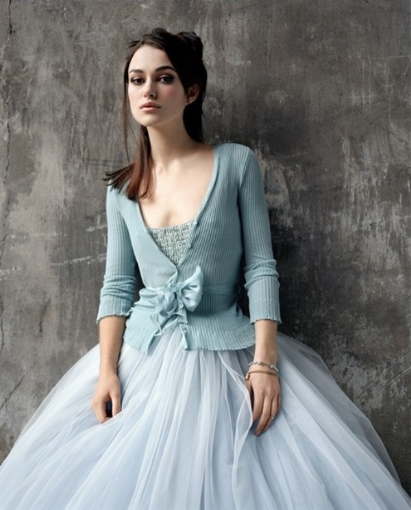 An ice blue top and a matching cardigan with a tulle skirt make up a chic and beautiful winter bridal look