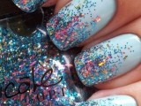 an ice blue winter wedding manicure with confetti is a nice and bold idea for a bride or bridesmaid