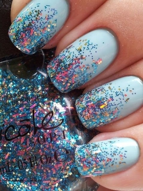 An ice blue winter wedding manicure with confetti is a nice and bold idea for a bride or bridesmaid